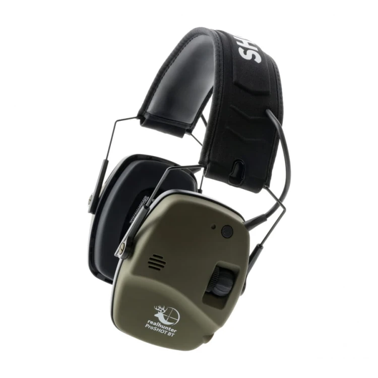 Detail pokrętła regulacji głośności i przycisku Bluetooth na muszli słuchawek.